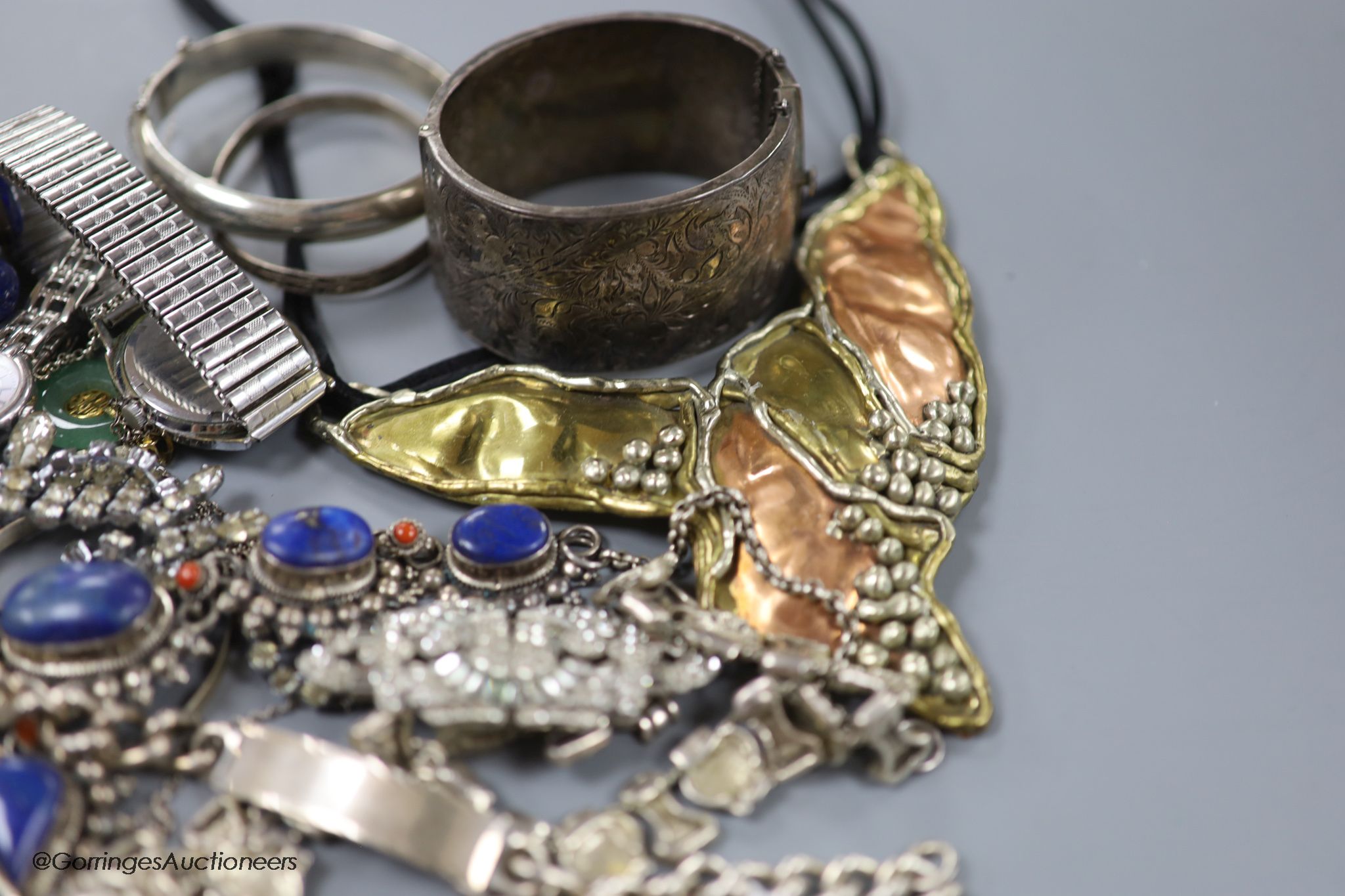 A collection of mixed silver and other costume jewellery.